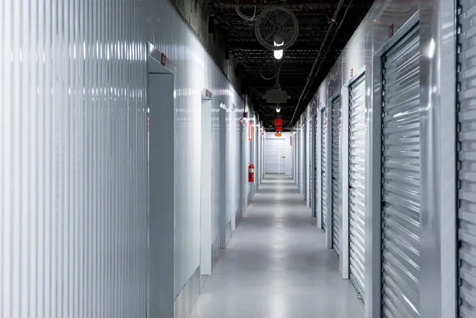 Secure indoor storage facility corridor with climate-controlled units